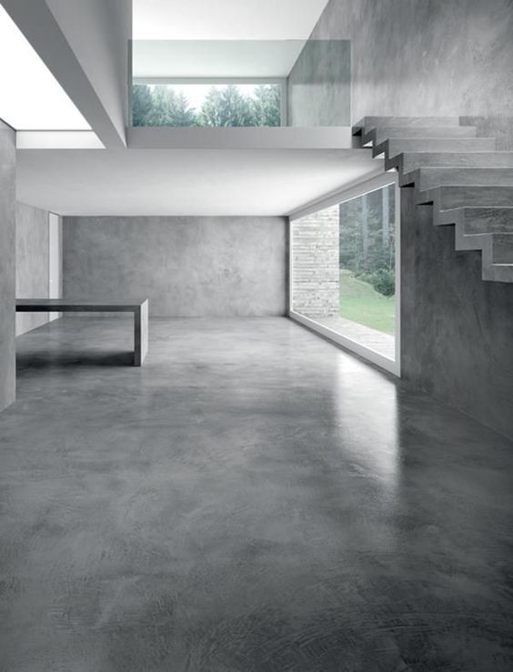 Exemple d'intérieur de maison moderne et contemporain avec un sol en béton lissé